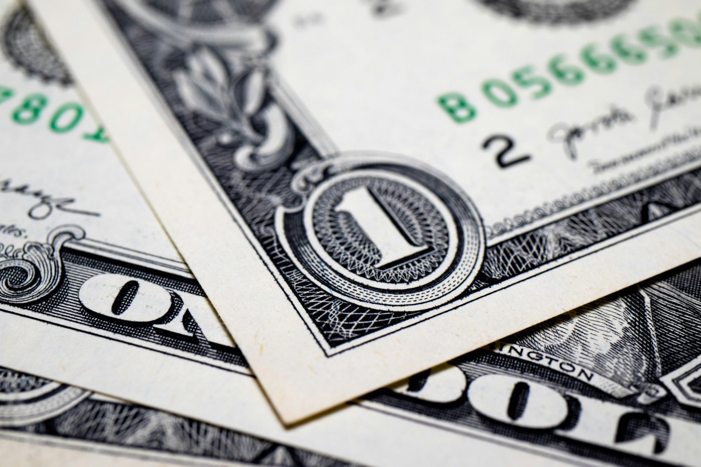 A macro close-up of the corner detail on a one dollar bill